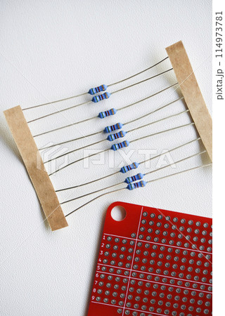 Red printed circuit board and chips and radio components. Capacitors and transistors. Red printed circuit board and chips and radio components. Capacitors and transistors. 114973781