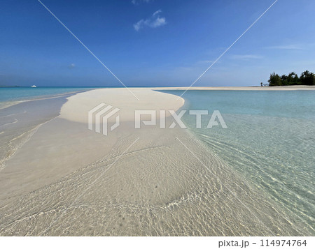 Clear shallow water of Treasure Cay, Abaco, Bahamas on sunny summer day. Clear shallow water of Treasure Cay, Abaco, Bahamas on sunny summer day. 114974764