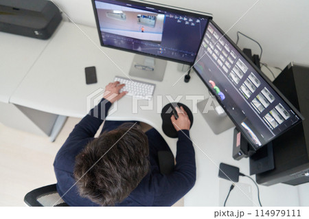 professional video editor enhancing digital footage using specialized software professional video editor enhancing digital footage using specialized software 114979111