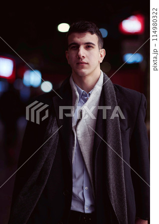 Smiling Meedle Eastern man walking down street near modern office building, Smiling Meedle Eastern man walking down street near modern office building, 114980322