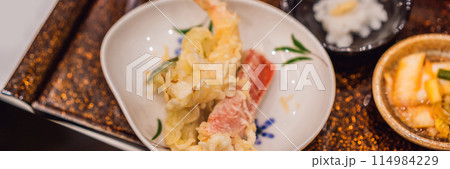 Bento set of prawn tempura and chicken teriyaki in japanese restaurant BANNER, LONG FORMAT 114984229