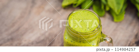 Ginger green apple smoothie on concrete background. It can be used as a background BANNER, LONG FORMAT Ginger green apple smoothie on concrete background. It can be used as a background BANNER, LONG FORMAT 114984257