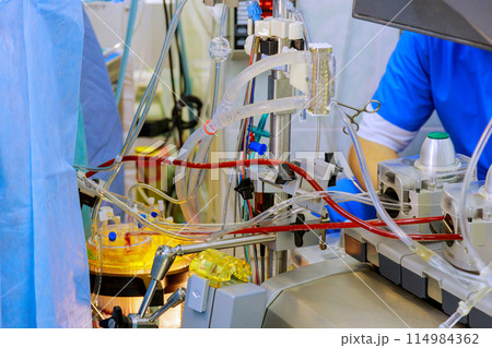 During doctor performing surgery used surgical equipment, anesthesia machine in operating room 114984362