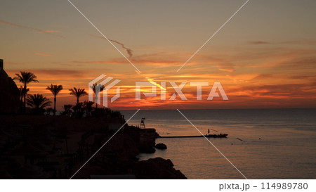 Sea coastline at dawn. 114989780