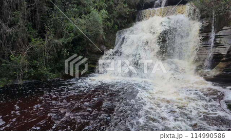 Ethereal Slow-Motion Waterfall Cascading Over A Natural Rock Ethereal Slow-Motion Waterfall Cascading Over A Natural Rock 114990586