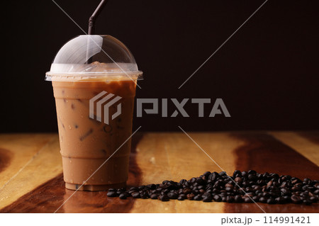 ice espresso on wood floor 114991421