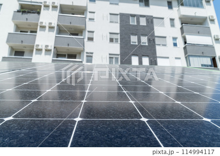 Solar panels near an apartment building Solar panels near an apartment building 114994117