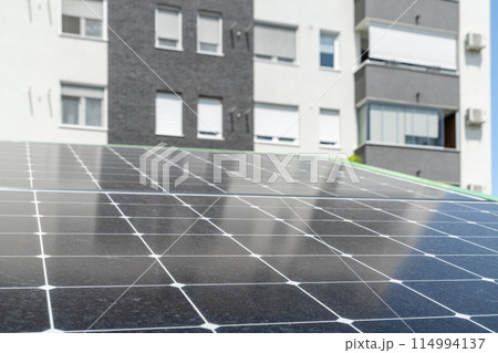 Solar panels near an apartment building Solar panels near an apartment building 114994137