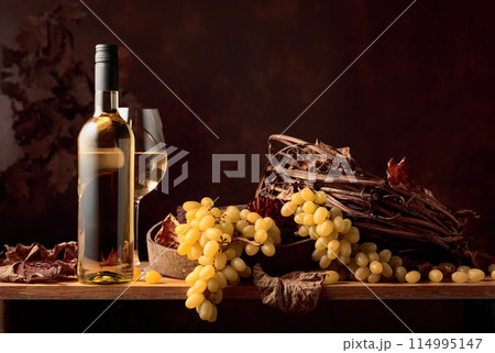 White wine and bunch of grapes. White wine and bunch of grapes. 114995147