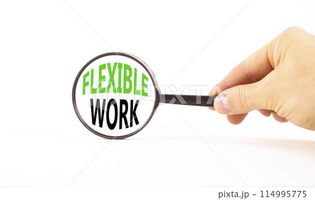 Flexible work symbol. Concept words Flexible work in beautiful magnifying glass. Beautiful white paper background. Businessman hand. Business Flexible work concept. Copy space. Flexible work symbol. Concept words Flexible work in beautiful magnifying glass. Beautiful white paper background. Businessman hand. Business Flexible work concept. Copy space. 114995775