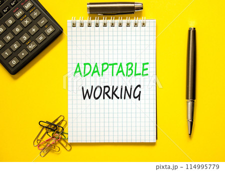 Adaptable working symbol. Concept words Adaptable working on beautiful white note. Beautiful yellow paper background. Calculator. Black pen. Business Adaptable working concept. Copy space. 114995779