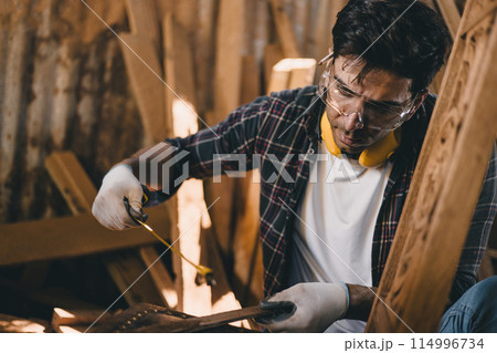 professional carpenter man hand working make wooden handcraft furniture master workpiece fine detail artisan with wood workshop. professional carpenter man hand working make wooden handcraft furniture master workpiece fine detail artisan with wood workshop. 114996734