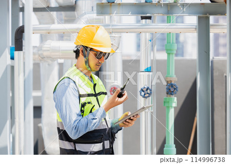 engineer checking gas pipe watering system, professional worker service team working with pipe valve check pump boiler system engineer checking gas pipe watering system, professional worker service team working with pipe valve check pump boiler system 114996738