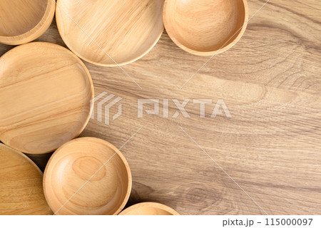 Kitchen utensils, wooden bowl, plate and dish on wooden background, Table top view 115000097