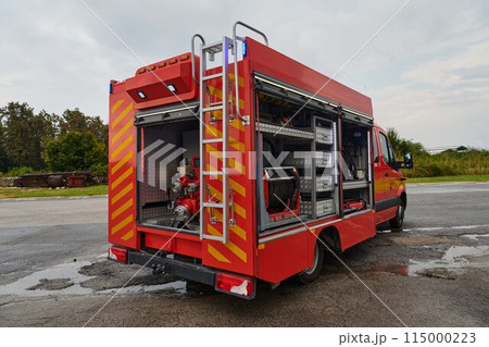 A state-of-the-art firetruck, equipped with advanced rescue technology, stands ready with its skilled firefighting team, prepared to intervene and respond rapidly to emergencies, ensuring the safety A state-of-the-art firetruck, equipped with advanced rescue technology, stands ready with its skilled firefighting team, prepared to intervene and respond rapidly to emergencies, ensuring the safety 115000223