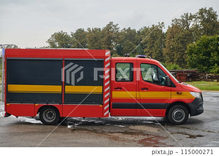 A state-of-the-art firetruck, equipped with advanced rescue technology, stands ready with its skilled firefighting team, prepared to intervene and respond rapidly to emergencies, ensuring the safety 115000271