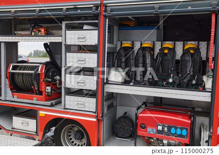 Close-up of essential firefighting equipment on a modern firetruck, showcasing tools and gear ready for emergency response to hazardous fire situations 115000275