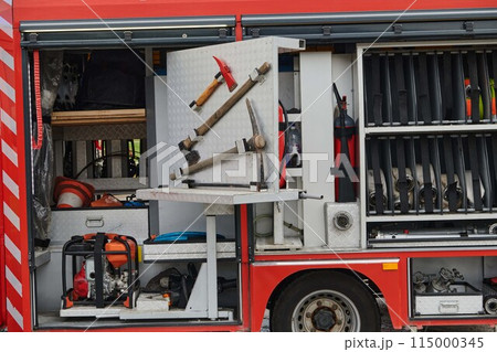 Close-up of essential firefighting equipment on a modern firetruck, showcasing tools and gear ready for emergency response to hazardous fire situations Close-up of essential firefighting equipment on a modern firetruck, showcasing tools and gear ready for emergency response to hazardous fire situations 115000345