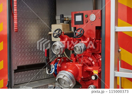 Close-up of essential firefighting equipment on a modern firetruck, showcasing tools and gear ready for emergency response to hazardous fire situations 115000373