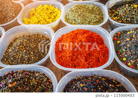 assortment of various oriental herbal and flower teas on spice bazaar on counter in Uzbekistan 115000483