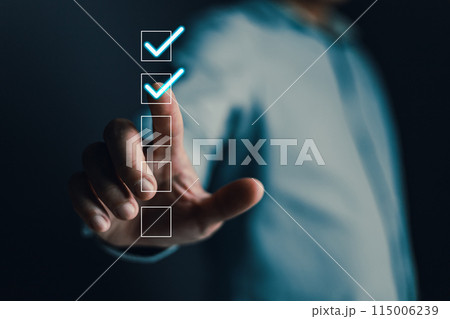 Businessmen touch the checkbox on a box in the list shown on the virtual screen. Check marks on the checklist survey items and questionnaires. Business management goal strategy concept. Businessmen touch the checkbox on a box in the list shown on the virtual screen. Check marks on the checklist survey items and questionnaires. Business management goal strategy concept. 115006239