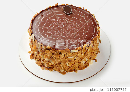 Classic Esterhazy cake with chocolate icing and almond flakes Classic Esterhazy cake with chocolate icing and almond flakes 115007735