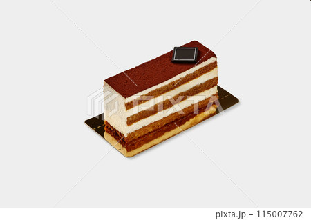 Slice of traditional Italian tiramisu cake on white backdrop Slice of traditional Italian tiramisu cake on white backdrop 115007762