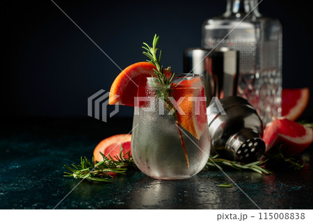 Cocktail gin tonic with ice, grapefruit, and rosemary. 115008838