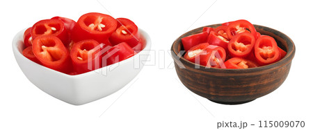 red hot chili pepper slices in ceramic bowl isolated on white background red hot chili pepper slices in ceramic bowl isolated on white background 115009070
