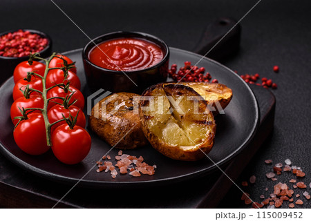 Delicious halved potatoes grilled with salt, spices and herbs 115009452