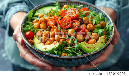 Person Holding Bowl Filled With Salad 115010001