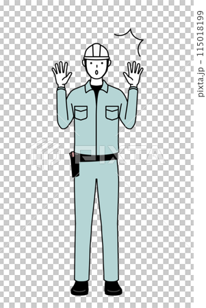 A man in a helmet and work clothes raising his hands in surprise 115018199