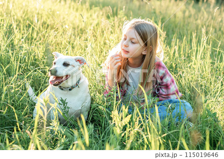 A child with a dog in nature 115019646