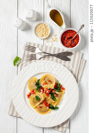 italian pasta mezzelune on a plate, top view italian pasta mezzelune on a plate, top view 115020077