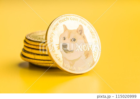 Golden dogecoin coin. Cryptocurrency dogecoin. Doge cryptocurrency on yellow background. Golden dogecoin coin. Cryptocurrency dogecoin. Doge cryptocurrency on yellow background. 115020999