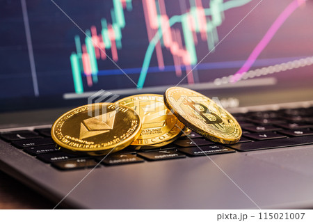 Bitcoin, litecoin and ethereum. Cryptocurrency on computer a keyboard and business chart on screen on background. 115021007