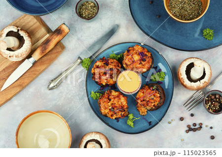 Tasty stuffed baked mushroom caps. 115023565