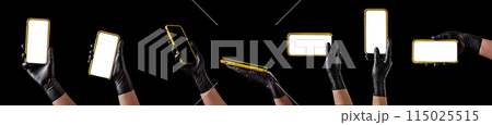 Hand in black glove holding mobile phone with blank screen isolated on black Hand in black glove holding mobile phone with blank screen isolated on black 115025515