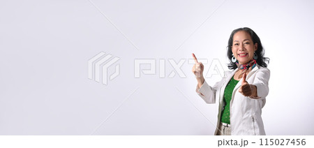 Smiling senior businesswoman pointing aside with copy space isolated on white background Smiling senior businesswoman pointing aside with copy space isolated on white background 115027456