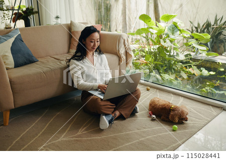 Small Dog Owner Working from Home Small Dog Owner Working from Home 115028441