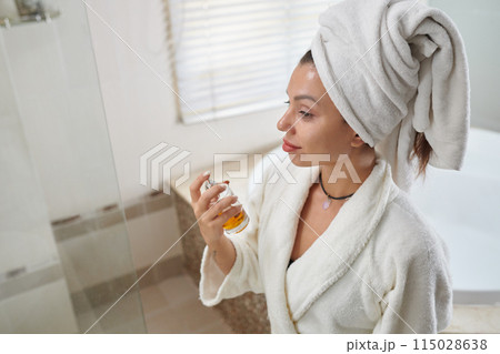 Woman Applying Body Fragrance 115028638