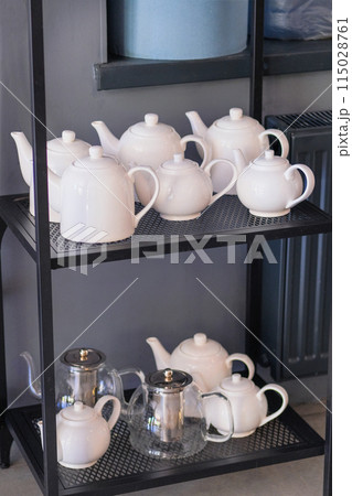 Teapots are prepared for use in cafes. Professional tableware for the dining room. Teapots are prepared for use in cafes. Professional tableware for the dining room. 115028761