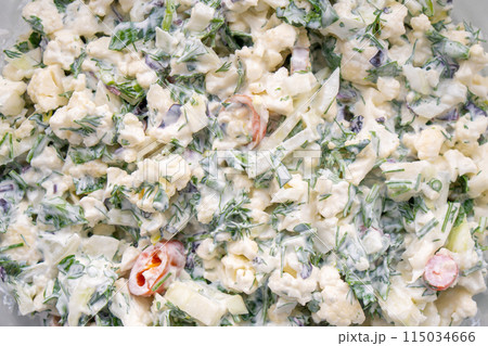 Cauliflower salad, lots of greens and other vegetables with sour cream Cauliflower salad, lots of greens and other vegetables with sour cream 115034666