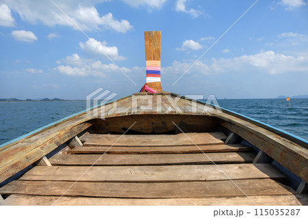The area in front of a long-tailed boat is made of wood and the sky in the background.Sailing on the Andaman Sea thailand 115035287