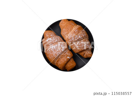 Delicious crispy golden croissant with chocolate filling 115038557