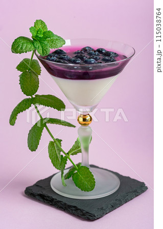 Panna cotta dessert with berry and cream layers. Panna cotta dessert with berry and cream layers. 115038764