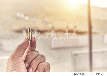 The power of a life in your fingers, holding a 9mm bullet. 115039572