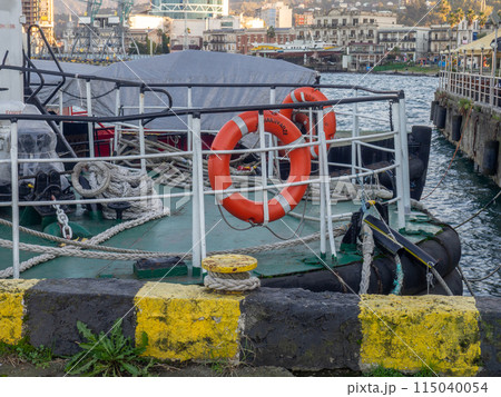Bollard for mooring. Place for fixing the ship. Mooring. Iron posts. At the seaport. The concept of navigation. Bollard for mooring. Place for fixing the ship. Mooring. Iron posts. At the seaport. The concept of navigation. 115040054