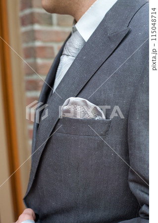 Elegant Gray Suit with Pocket Square, perfect for formal events like weddings or business meetings 115048714