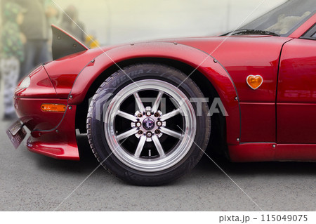 Russia, Novosibirsk, 25.05.2024 Midday, Red Mazda Miata MX-5 Roadster 1989, in tuning, Rocket Bunny Rear Bumper Extensions, pop-up headlights Russia, Novosibirsk, 25.05.2024 Midday, Red Mazda Miata MX-5 Roadster 1989, in tuning, Rocket Bunny Rear Bumper Extensions, pop-up headlights 115049075